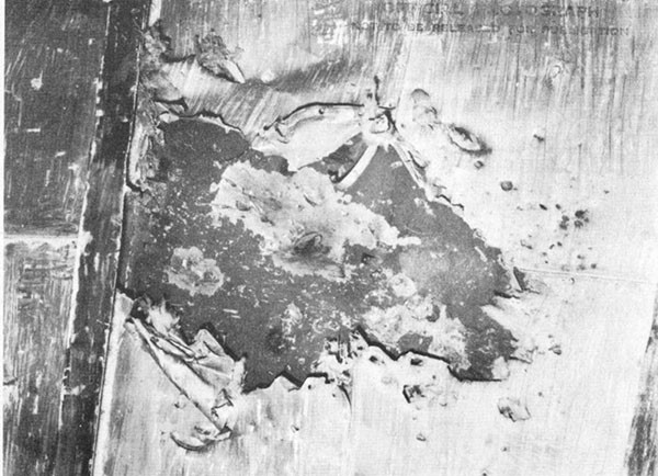 Photo 30: Hit No. 22. Damage to port structural bulkhead in battle dressing room.