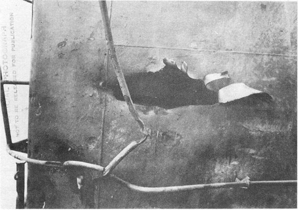 Photo 31: Hit No. 23. Damage to starboard side of stack hood.