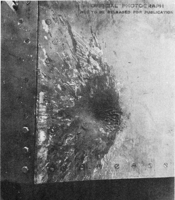 Photo 33: Hit No. 24. Damage to 5-inch mount No. 5 from glancing hit by 6-inch projectile.