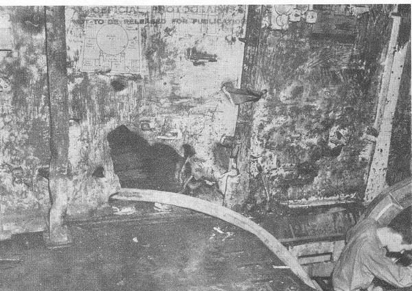 Photo 37: Hit No. 26. Damage to bulkhead 129 above second deck.