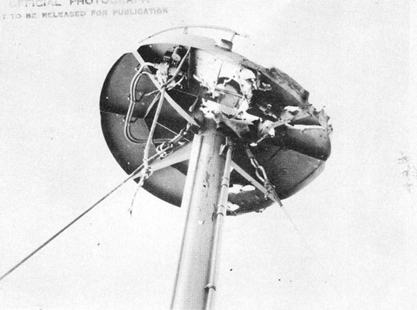 Photo 39: Damage to radar platform apparently from a projectile that detonated on contact.