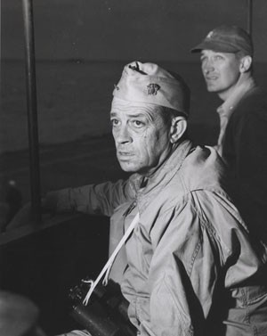 Rear Admiral Clifton A. F. Sprague, US Navy, aboard USSFanshaw By (CVE-70) off Okinawa in April 1945. Photographic Section, Naval History and Heritage Command, #80-G-371327.