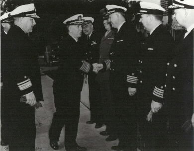 Admiral Royal E. Ingersoll, ComWESTERN SEA FRONTIER, greets senior officers while inspecting the Mare Island Navy Yard, 15 March 1945. Rear Admiral Tisdale, Comdt of Mare Island Navy Yard is at left. In the receiving line are (l-r): Capt. W.C. Es...