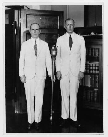 Rear Admiral William D. Leahy, USN (left), and his aide, Lieutenant Commander Ernest H. Von Heimburg, with a historic Canadian mace.