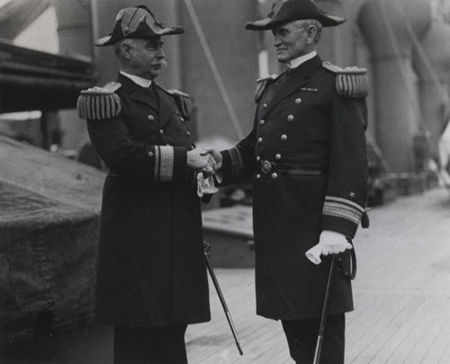 Rear Admiral Cameron M. Winslow (at left), being relieved by Rear Admiral William B. Caperton, as CINCPACFLT on 28 July 1916 aboard USS Pittsburg (CA-4). Photographic Section, Naval History and Heritage Command, #NH83774.
