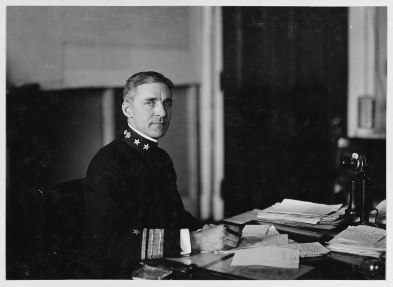 black and white photograph of Rear Admiral Palmer seated at his desk