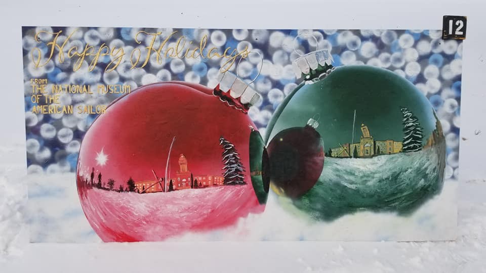 This painting of NSGL's Building 1 reflecting in ornaments won the “Most Artistic” category of the Naval Station Great Lakes Morale, Welfare and Recreation Department’s Annual Holiday Card Challenge.