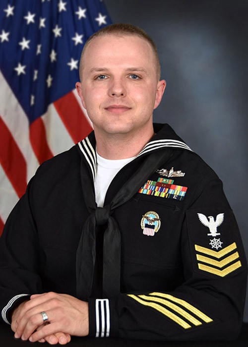 Petty Officer First Class Zachary Corallo educates about the LBGTQ community in the military.