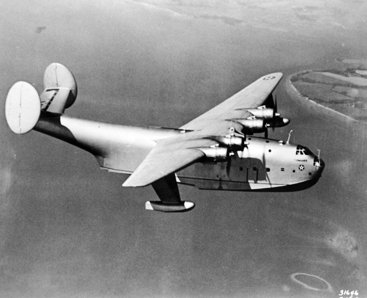 LC-Lot-3465-6: Martin JRM “Mars” aircraft, XPB2M-1, 1941.   Original caption, “Seventy tons of fighting strength were added to the Navy air force when Mars, the largest ship ever to fly, was completed. A Martin-built plane, it has four 2,000 horsepower motors, a hull the size of a 15-room house, and a wing-expansion equivalent to the height of a 20-story building. Mars can fly non-stop to Europe and back. Office of War Information photograph. Courtesy of the Library of Congress. 