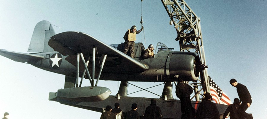 80-G-K-13592:   OS2U-3 “Kingfisher” aircraft hoisted onto a battleship catapult, late 1942.   Official U.S. Navy Photograph, now in the collections of the National Archives.   