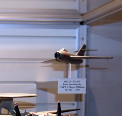 An aircraft model of a MiG-15 is on display in the North End of the Cold War Gallery