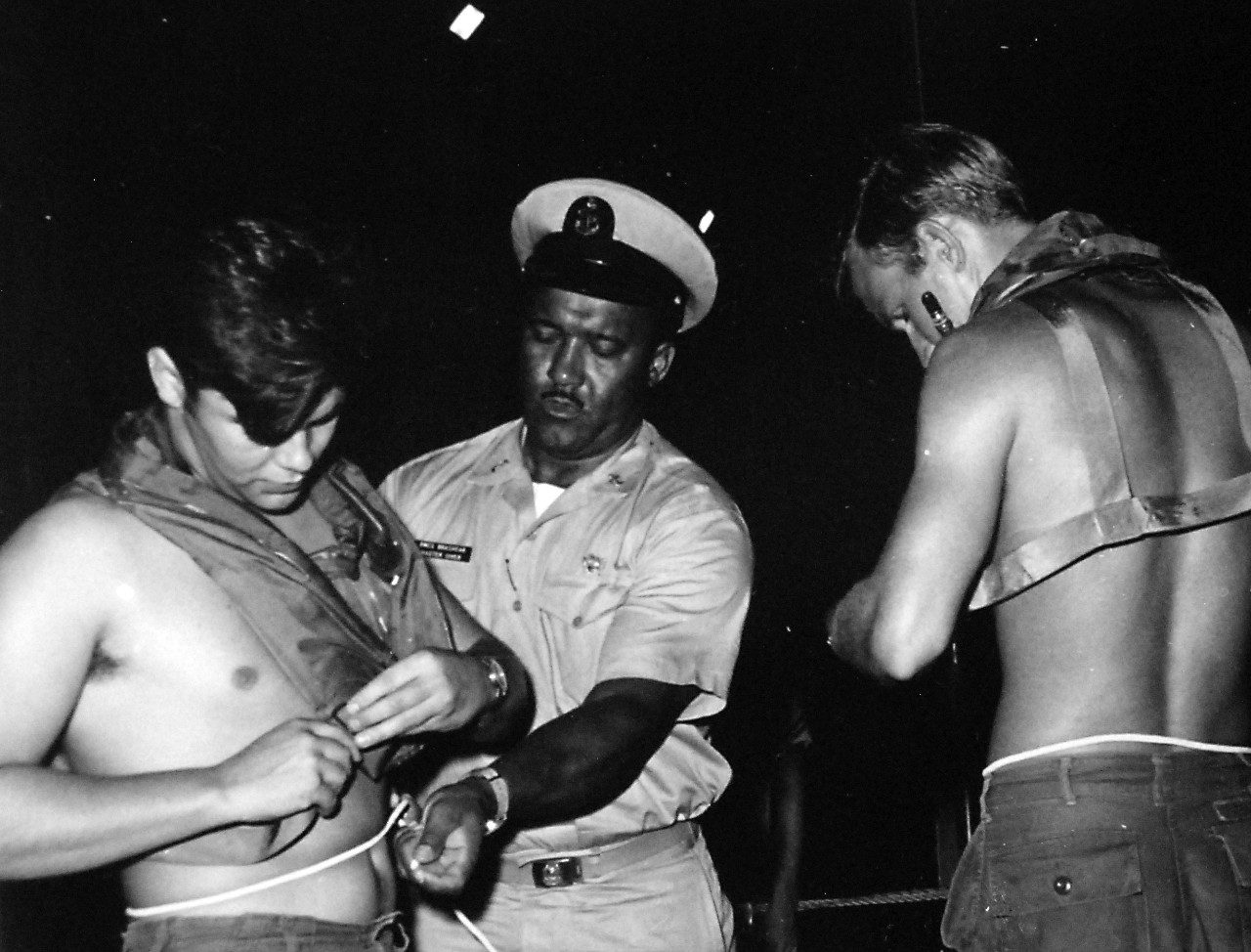 428-GX- USN 118932:  Senior Chief Boatswain’s Mate and Master Diver Carl M. Brashear, April 1971.  Brashear assists another diver as he prepares to enter the water from USS Hunley  (AS-31).  Photographed by PHC A.J. Walker, April 22, 1971.  Official U.S. Navy Photograph, now in the collections of the National Archives.  