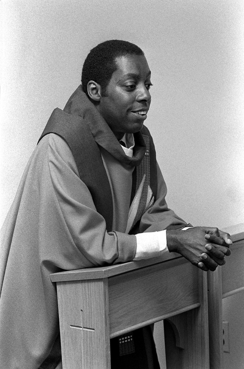 330-CFD-DN-SN-82-10583:   Lieutenant Leslie Branch, 1982.   Leslie Branch was the first African American Roman Catholic chaplain.   Branch is wearing vestment and kneels in prayer prior to his commissioning.    Photographed by PH1 Paul Salesi, Navy Chaplain’s School, Newport, Rhode Island.   Official U.S. Navy photograph, now in the collections of the National Archives. 