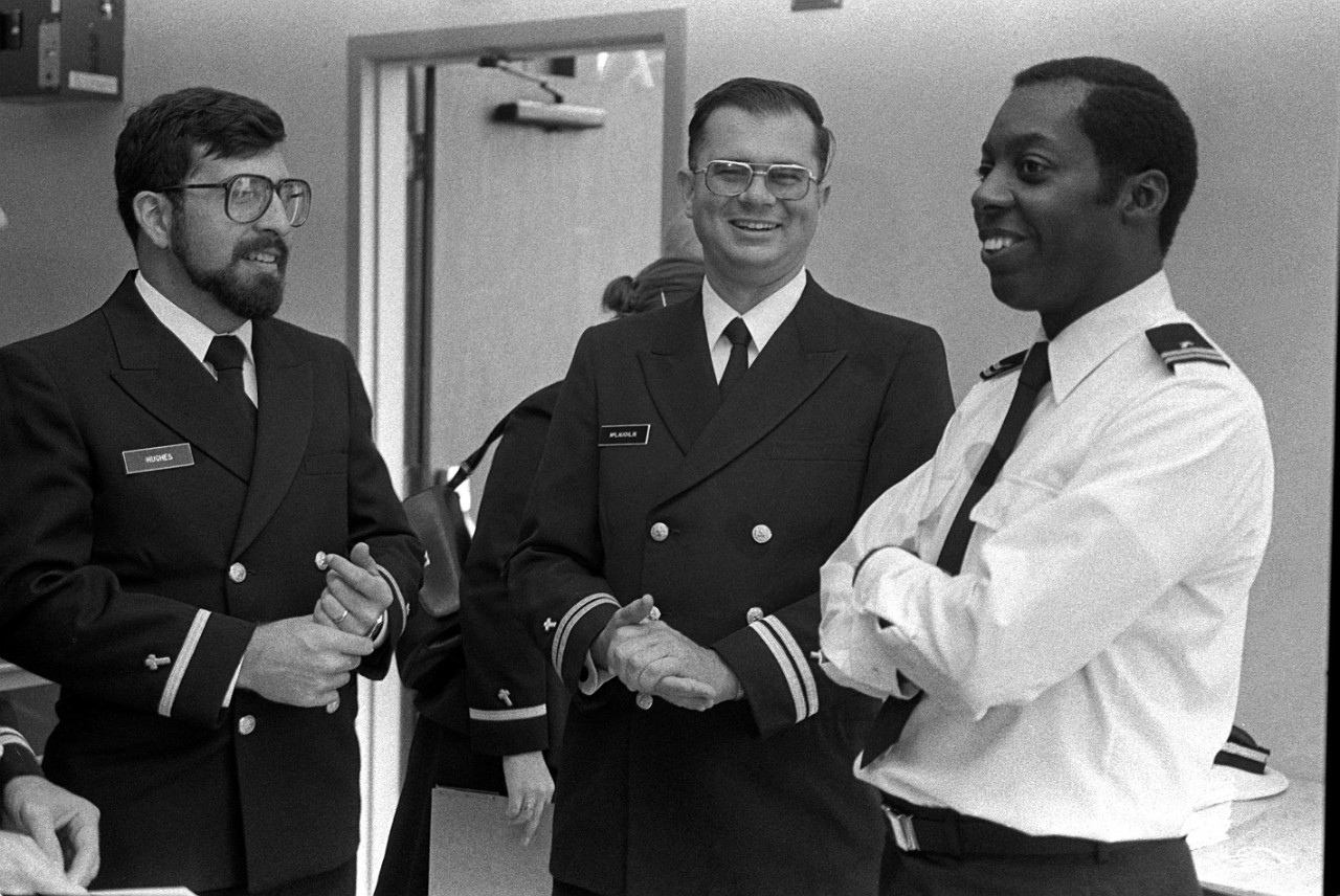 330-CFD-DN-SN-82-10585:    Lieutenant Leslie Branch, 1982.   Leslie Branch was the first African American Roman Catholic chaplain.   He is talking with other chaplains prior to commissioning.   Photographed by PH1 Paul Salesi, Navy Chaplain’s School, Newport, Rhode Island.   Official U.S. Navy photograph, now in the collections of the National Archives. 