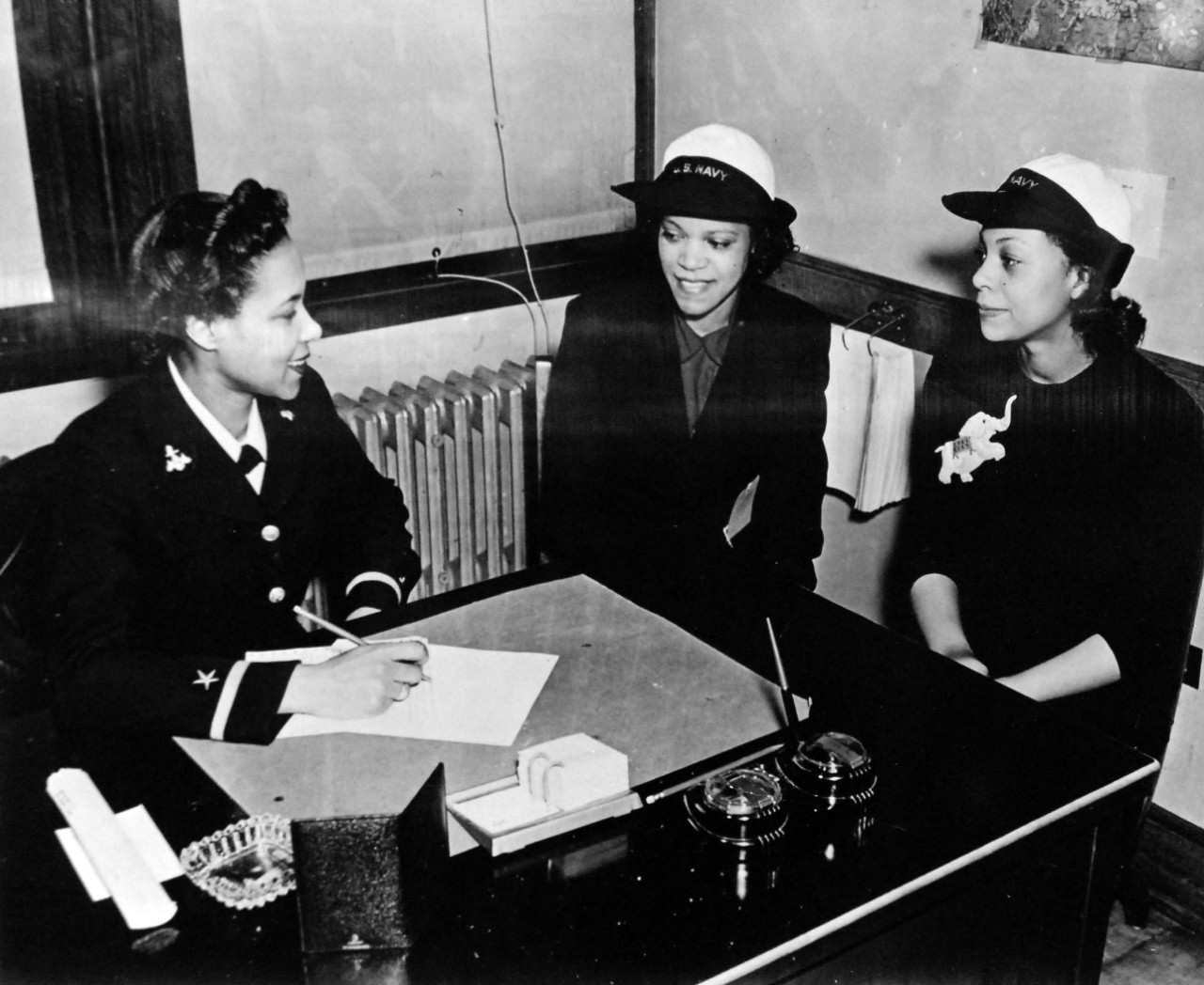 208-NP-8CC-1:  African American Women Recruits in Naval Reserve, 1944.   Ensign Francis Willis, one of the first two African American naval officers in the Women’s Reserve, is interviewing two African American enlisted WAVES.  Official U.S. Navy photograph, now in the collections of the National Archives.  