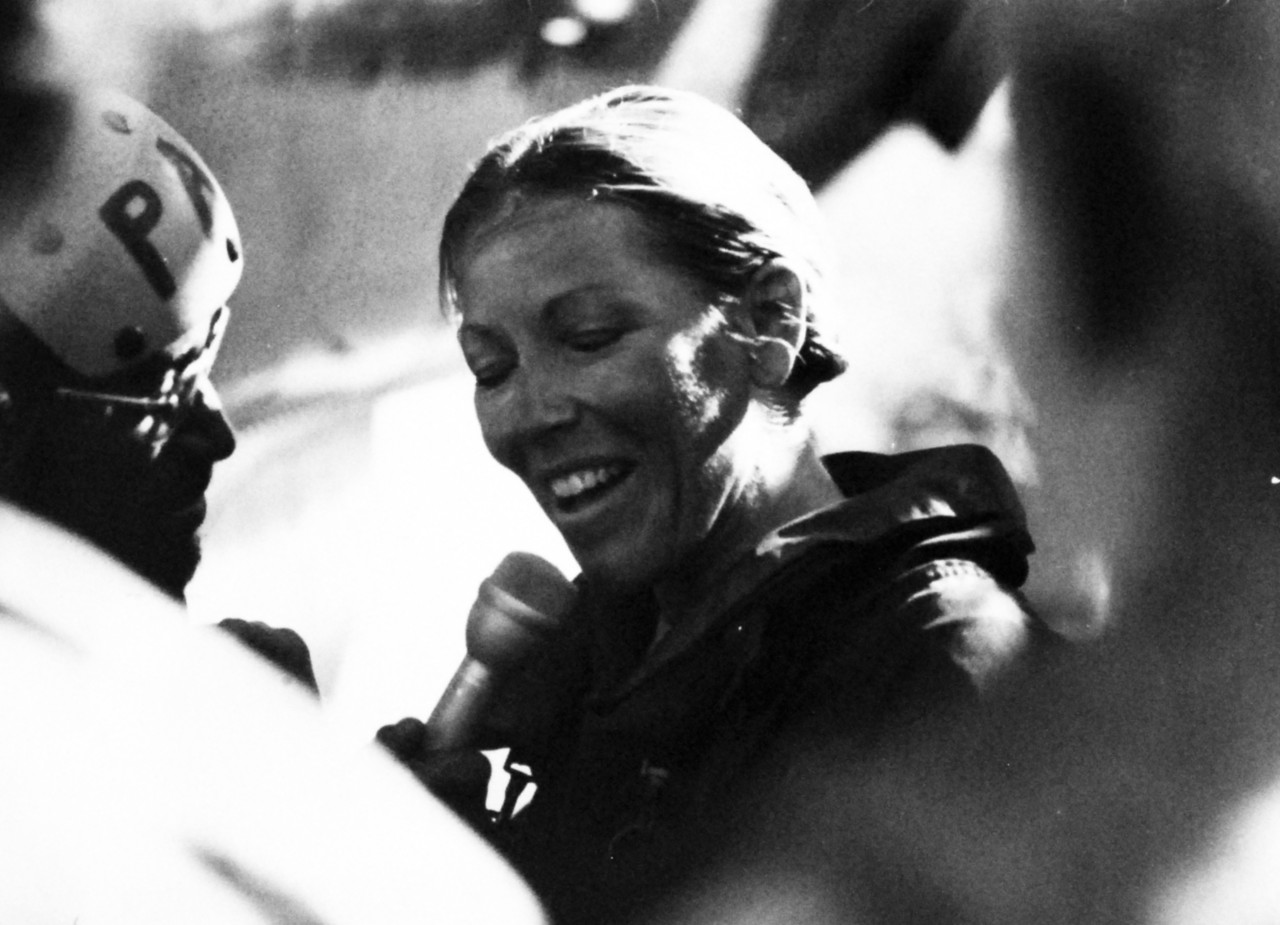 428-GX-USN-1175091:   Lieutenant Donna Lynn Spruill , July 1979.   Spruill of Fleet Logistical Support Squadron 40, VRC-40, is interviewed from the flight deck of USS Independence (CV-12).  Lieutenant Spruill was the first female Naval Aviator to qualify on an aircraft carrier in a fixed wing aircraft.  Photographed July 20, 1979.  U.S. Navy Photograph, now in the collections of the National Archives.  