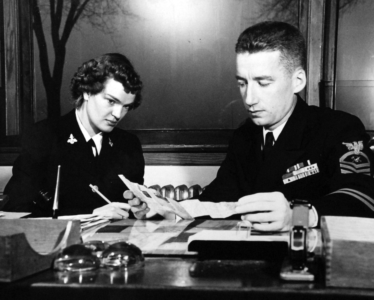80-G-428485:   WAVES at Fleet Hometown News Center, Naval Training Center, Great Lakes, Illinois, May 1951.    Seaman Apprentice Naydean Remmerts (left) gets some practical information from Chief Journalist Frank J. Madden, USN.   Official U.S. Navy photograph, now in the collections of the National Archives. 