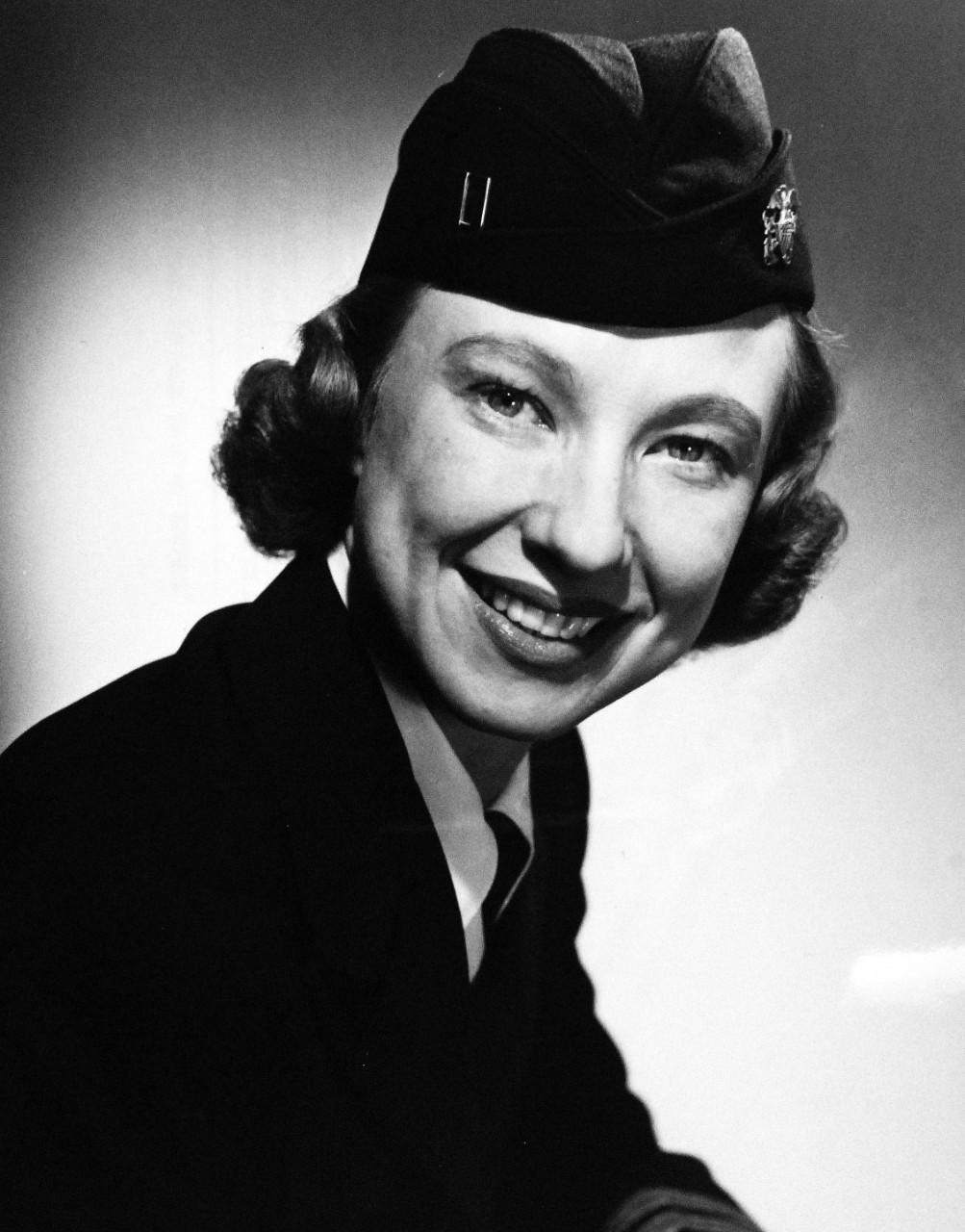 USN 708330:  U.S. Navy WAVE Lieutenant Ordered to Duty in U.S. Embassy, Oslo, Norway.   Lieutenant Francina Stonesifer reported in May 1952 for duty in the Office of the Naval Attaché, U.S. Embassy, Oslo, Norway.  She was the first woman in the U.S. Navy to be selected for an attaché assignment. Photograph released April 18, 1952.  Official U.S. Navy photograph, now in the collections of the National Archives. 