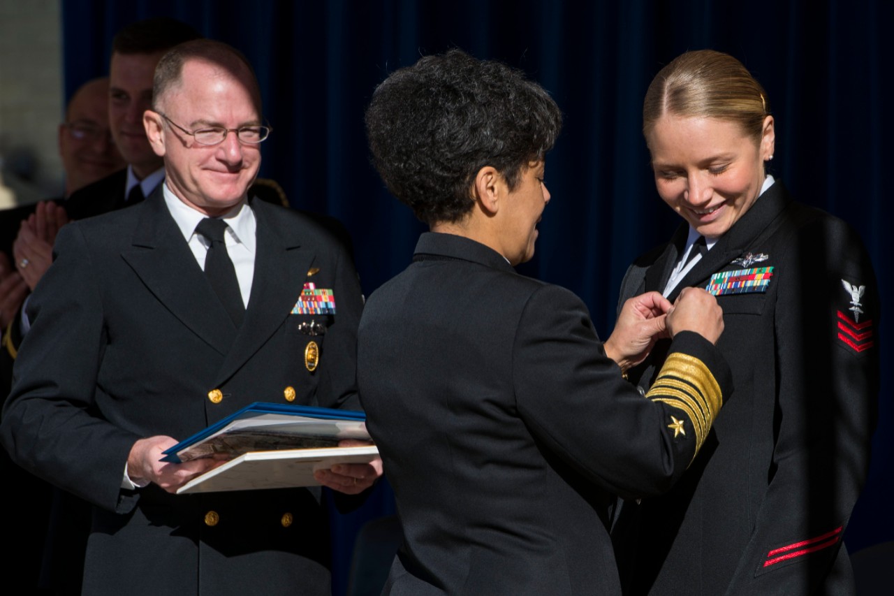 160330-N-VC236-073:   Vice Chief of Naval Operations Michelle Howard, 2016.  Admiral Howard presents an award to Hospital Corpsman 1st Class Jessica Wentlent upon her selection as the 2015 Shore Sailor of the Year during a ceremony at the Pentagon, March 30. Wentlent will return in May along with the two Fleet Sea Sailors of the Year and the Reserve Sailor of the Year for meritorious advancement to chief petty officer.   Photographed on March 30, 2016.   U.S. Navy photo by Mass Communication Specialist 3rd Class Jackie Hart.   Official U.S. Navy Photograph.  