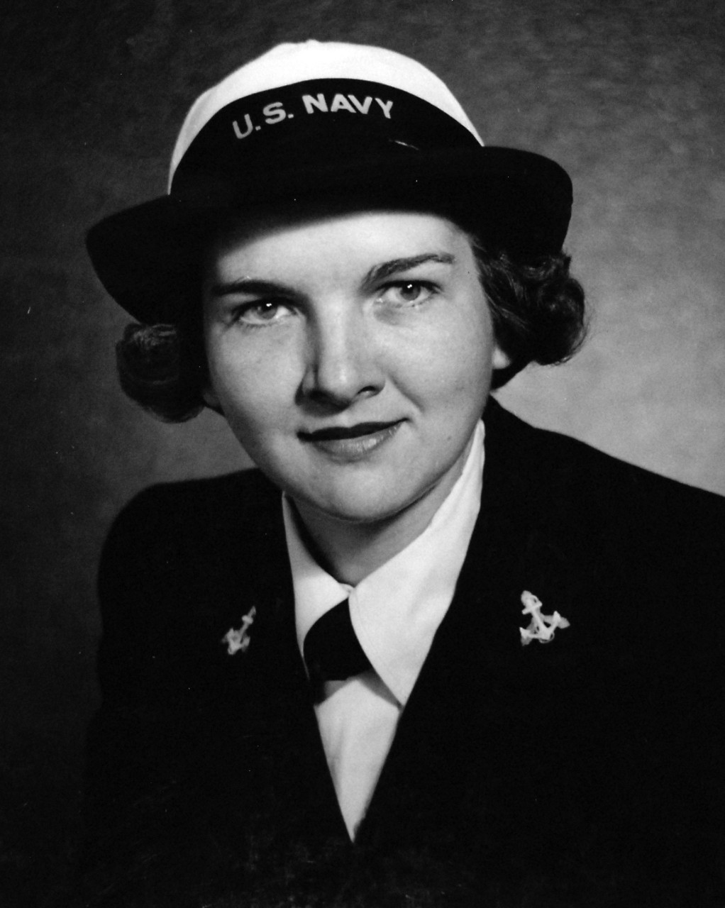 80-G-41568:   Yeoman Third Class Ruby Gale Chisler, USNR, May 1943.   Chisler was one of the first two enlisted women selected for officer training in the Women’s Reserve, is a graduate of Fairmont State College, Fairmont, West Virginia, and did graduate work there and at the North Carolina State College of Engineering in Raleigh, North Carolina.  Before enlisting, she was an art teacher in Elizabeth City, North Carolina; Monogalla County, West Virginia; and Alliance, Ohio.  Photograph released May 20, 1943.  Official U.S. Navy Photograph, now in the collections of the National Archives. 