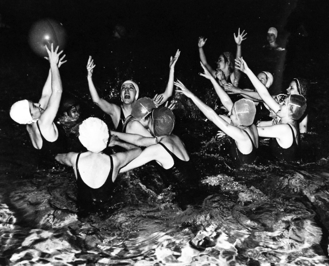 80-G-471606:   U.S. Naval Training Center, Women’s Reserve, Cedar Falls, Iowa, February 1943.   WAVES playing water polo at Boot Camp, Cedar Falls, Iowa.   Photographed by PH2 Howard Liberman.  Steichen Photograph Unit, TR-3010.  Official U.S. Navy photograph, now in the collections of the National Archives.   