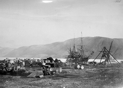 LC-USZ62-17183:  Lady Franklin Bay Expedition, 1881-84, led by Lieutenant Adolphus Greely.  The Expedition was rescued by the U.S. Navy in June 1884.  Shown:   Expeditionary stores and game stand at Discovery Harbor, Proteus in the background and Post Office Cairn to the right, August 1881.  Proteus was crushed in the ice in 1883.   Courtesy of the Library of Congress.  