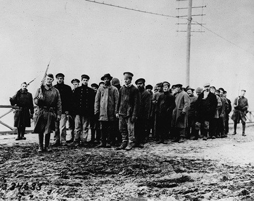 111-SC-34633:  U.S. Army Troops guard Bolshevik Prisoners of War at Archangel, October 16, 1918.   U.S. Army photograph, now in the collections of the National Archives.   