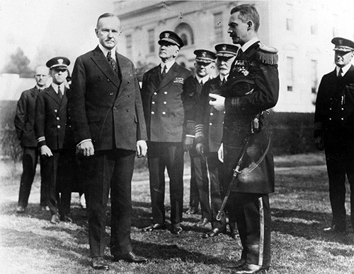 NH 52667:  Lieutenant Commander Walter A. Edwards, USN, receives the Medal of Honor from President Calvin Coolidge at the White House, Washington, D.C., February 2, 1924.  NHHC Photograph Collection.   