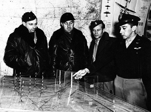 80-G-707093: Operation Vittles (Berlin Airlift). U.S. Navy air crews are briefed on a special model showing corridor routes and altitudes, April 1949. Official U.S. Navy Photograph, now in the collections of the National Archives photograph.