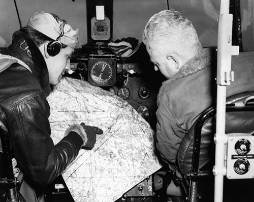 80-G-707096: Berlin Airlift. Pilots check their positions along the corridor enroute to Berlin, Germany, 1948. Official U.S. Navy Photograph, now in the collections of the National Archives photograph.