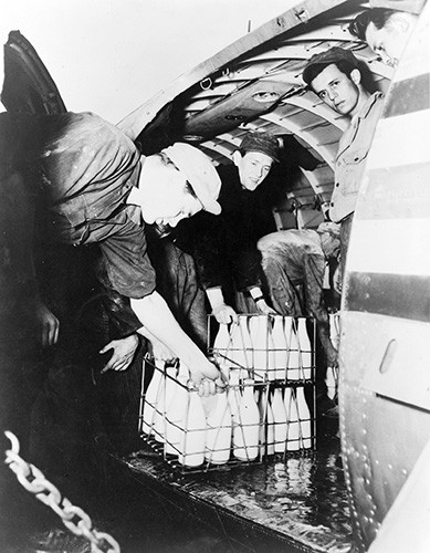 LC-USZ62-108143:   Operation Vittles (Berlin Airlift).  Bottles of fresh milk unloaded from a U.S. Air Force transport at Tempelhof Airdrome, Berlin, West Germany, 1948.   Courtesy of the Library of Congress.   
