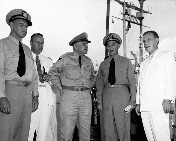 80-G-647030:  Passage to Freedom, September 1954.  Transportation of Vietnamese refugees to Saigon.   Officers and Officials at reception given on arrival of 100,000 refugees at Saigon, Vietnam.  Shown:  Admiral Stores; General McDaniels, Admiral Sabine, and Admiral Heath.  Official U.S. Navy Photograph, now in the collections of the National Archives.  