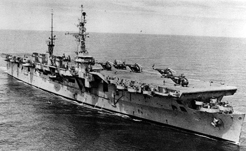 NH 67747:   USS Saipan (CVL-48), with HRS and HUP helicopters on her flight deck, circa mid-1950s.   NHHC Photograph Collection. 