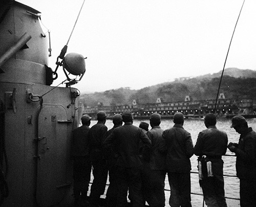 80-G-658120: Evacuation of Chinese from Tachen Island off China. Chinese soldiers get first sight of Formosa (now Taiwan). US Navy vessel is probably USS Lenawee (APA 195), 2 March 1955. Official U.S. Navy Photograph, now in the collections of th...