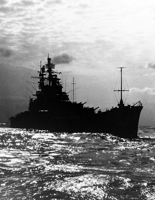 K-81521:  USS Newport News (CA-148), silhouetted while underway, March 1970.  Official U.S. Navy Photograph, now in the collections of the National Archives.   