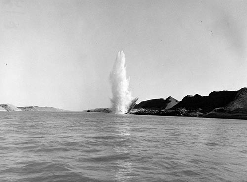 Explosion set off by Royal Navy divers on eastern side of the canal.  NHHC Photograph Collection, Navy Subject Files. 