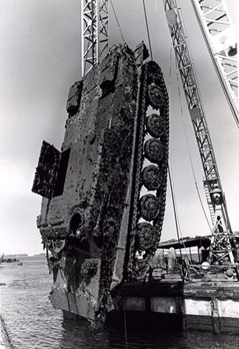 Egyptian Army armored personnel carrier, which sank during the crossing of the Suez Canal in October 1973.  APC was one of over 700 non-ordnance items discovered during search operations in the canal.   Photographed by PH1 Joe Leo, USN.   NHHC Photograph Collection, Navy Subject Files. 