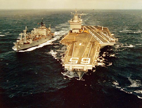 428-GX-K-103699:  USS Enterprise (CVAN-65), 1974.  Ammunition ship USS Shasta (AE-33), cruises into position to provide underway replenishment to the aircraft carrier.   Photographed by PH3 Don W. Redden, April 19, 1974.   Official U.S. Navy Photograph, now in the collections of the National Archives.  
