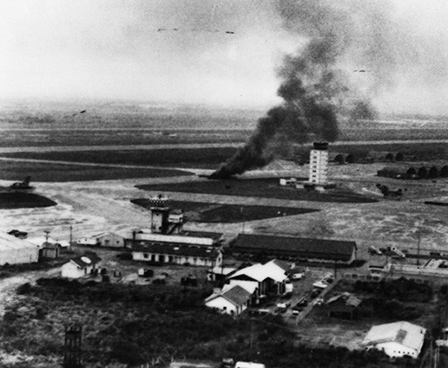127-GVB-279-A150966:  Operation Frequent Wind, April 29, 1975.   A South Vietnamese C-130 aircraft, trying to take off was hit by enemy SA-7 rockets and burns on the runway during the evacuation exercises in Saigon.   Official U.S. Marine Corps photograph, now in the collections of the National Archives.   