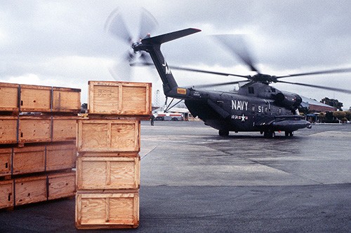 330-CFD-DF-ST-82-09994:   Right side view of a U.S. Navy RH-53D “Sea Stallion” helicopter from Fleet Logistics Support Squadron Twenty-Four taxiing to the runway.  The helicopter is carrying relief supplies for rural victims of a major earthquake, November 26, 1980.   Photographed by MSGT Don Sutherland.  Official U.S. Navy photograph, now in the collections of the National Archives.  
