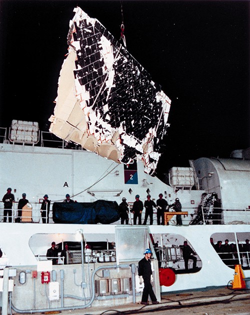 STS-51-L Debris Aboard the USCG Cutter Dallas, January 30, 1986.   With the help of the U.S. Coast Guard and the U.S. Navy, search and recovery teams began retrieving pieces of the Shuttle from the Atlantic Ocean soon after the accident. Vessels brought the debris to the Trident Basin at Cape Canaveral Air Force Station, where they waited to be shipped to Kennedy Space Center for investigation. The USCG Cutter Dallas transported this fragment of exterior tiling.  NASA Photograph Collection.  