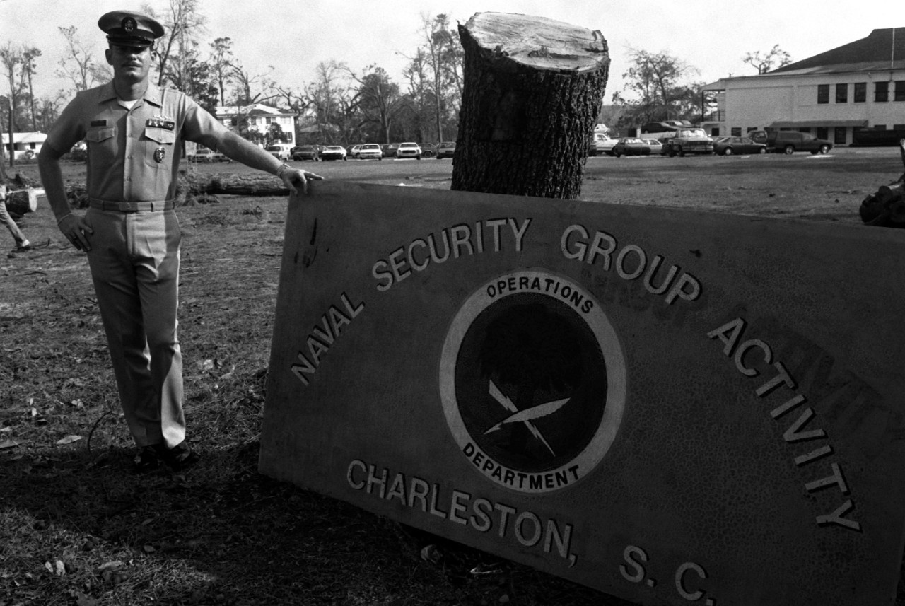 330-CFD-DN-SN-91-00702:  Charleston Naval Shipyard, Charleston, South Carolina.  Fall sign of the Naval Security Group Activity illustrates the force of Hurricane Hugo which passed through the area, October 3, 1989.    Official U.S. Navy photograph, now in the collections of the National Archives.   