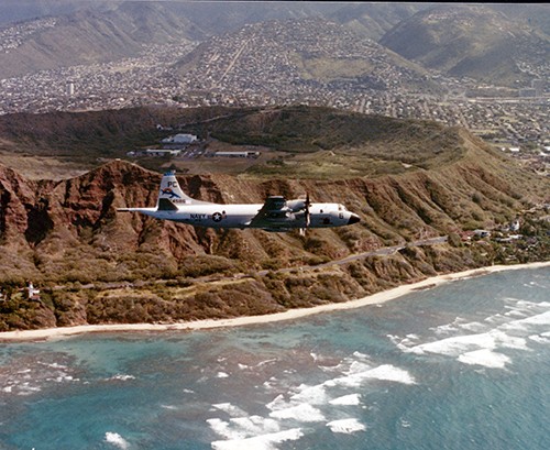 P-3 “Orion” flies past Diamond Head Crater, Hawaii, in the 1980s.  NHHC Photograph Collection, Navy Subject files.  