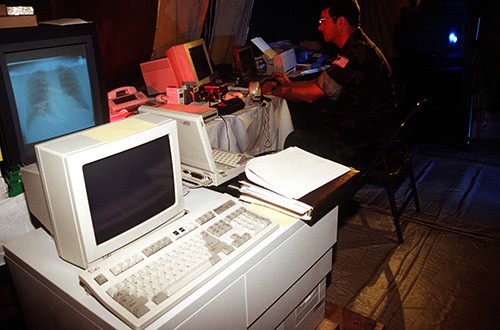 330-CFD-DD-ST-98-02261: Operation Provide Promise. Lieutenant Junior Grade Jim Martin provides support for Fleet Hospital Zagreb with the use of Telemed/Teleradiology and the Video Teleconference System. Photograph received April 30, 1994. Offici...