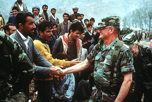 330-CFD-DA-ST-91-01191: Operation Provide Comfort. Lieutenant General John M. Shalikashvili, Commander, Joint Task Force, greets Kurdish citizens at Iskiveren, June 6, 1991. Official U.S. Army photograph, now in the collections of the National Ar...