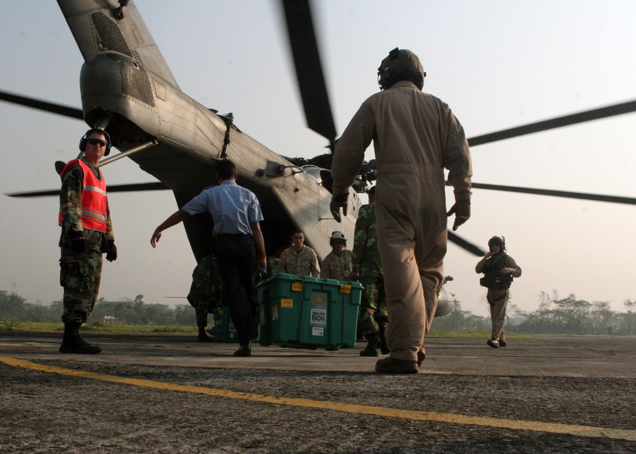 071128-M-3095K-027:   Marines with the 22nd Marine Expeditionary Unit (MEU) (Special Operations Capable) aid with the loading of care packages onto a CH-53E “Super Stallion” transport helicopter on Barisal Airfield in southern Bangladesh.   Photographed on November 28, 2007 by Sgt. Ezekiel R. Kitandwe.  Official U.S. Marine Corps photograph.  