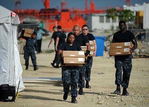 110821-N-NY820-119:  Sailors embarked onboard USNS Comfort (T-AH-20)  at Port-Au-Prince, Haiti, pack supplies during a site breakdown at the Terminal Verreux medical site in anticipation of severe weather from Hurricane Irene during Continuing Promise 2011.    Photographed on August 21, 2011 by MC2 Eric C. Tretter.   Official U.S. Navy Photograph.  