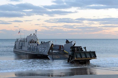 121105-N-RA981-029:   Sailors load a bulldozer onto an amphibious landing craft. (LCU-1663). The U.S. Navy has positioned forces in the area to assist U.S. Northern Command (NORTHCOM) in support of FEMA and local civil authorities following the destruction caused by Hurricane Sandy.    Photographed November 5, 2012 by MC3 Patrick Radcliff.   Official U.S. Navy Photograph.  