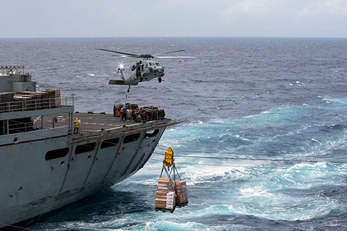 170928-N-KW492-392:  Pallets of supplies are transferred from the fast combat support ship USNS Supply (T-AOE 6) to the amphibious assault ship USS Kearsarge (LHD 3) during a replenishment-at-sea for continuing operations in Puerto Rico. Kearsarge is assisting with relief efforts in the aftermath of Hurricane Maria. Photographed on September 28, 2017 by (Mass Communication Specialist 3rd Class Ryre Arciaga.  Official U.S. Navy photograph.  
