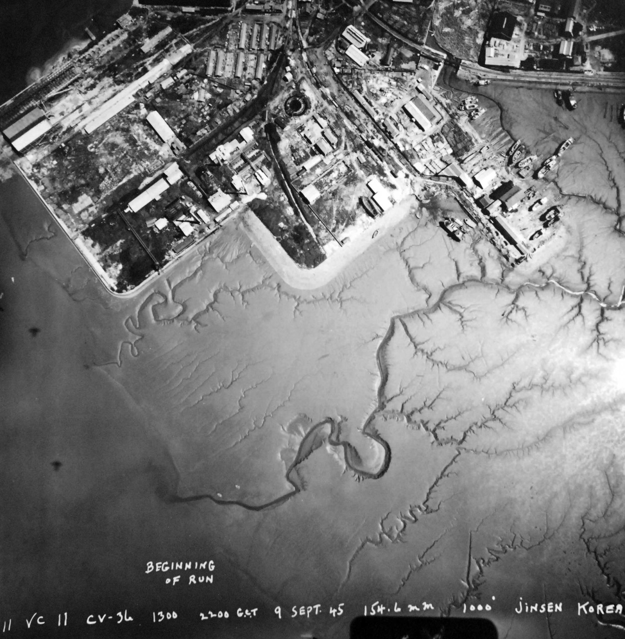 Lot-5767-4:  Aerial photo of Inchon, September 9, 1945. Aerial photographs show Korea during the Japanese Surrender on September 9, 1945.  Shown:  Jinsen (now Inchon).  Note, Allied Fleet off shore.  Photographed by aircraft from USS Antietam (CV-36).   U.S. Army Signal Corps Photograph.   Courtesy of the Library of Congress.  